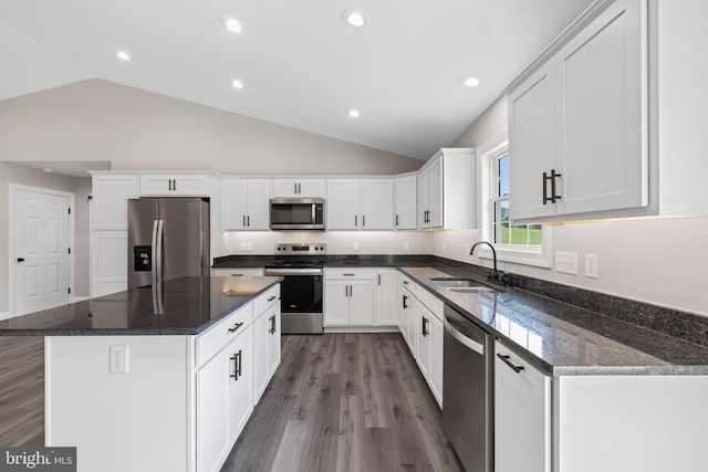 2434 Repton Mill Rd, Aroda, VA 22709 - kitchen featuring appliances with stainless steel finishes, a sink, vaulted ceiling, white cabinets, and a kitchen island