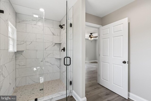 2434 Repton Mill Rd, Aroda, VA 22709 - full bath featuring a shower stall, a ceiling fan, baseboards, and wood finished floors