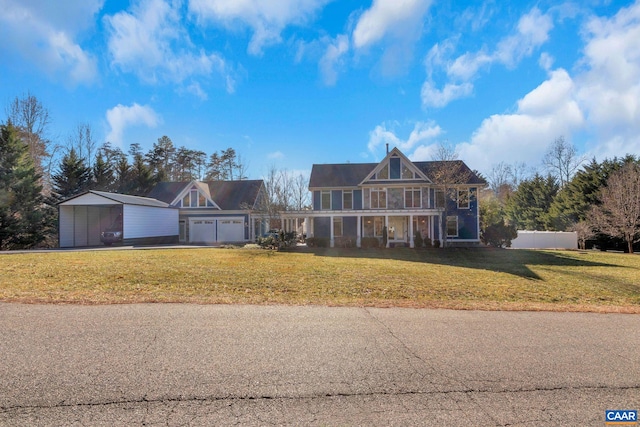 traditional home featuring a garage, driveway, a front yard, and a carport