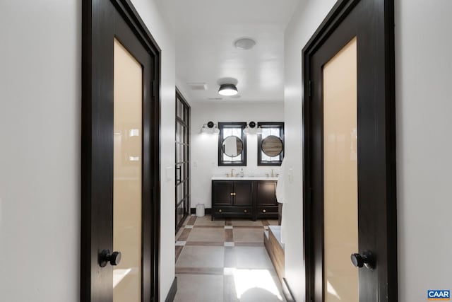 corridor featuring a sink