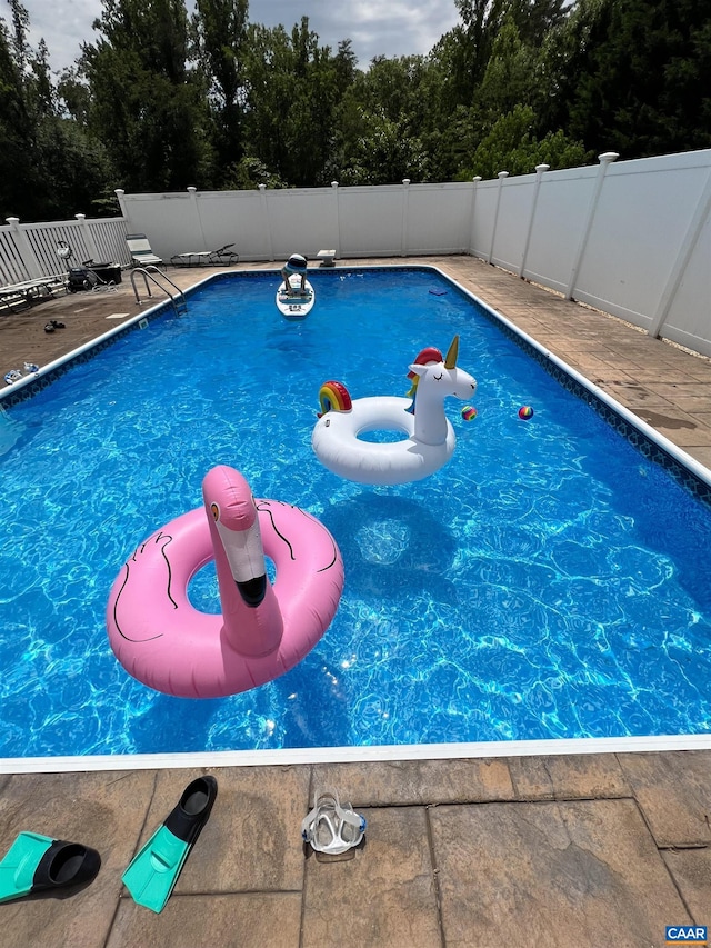 view of pool featuring a fenced in pool and fence