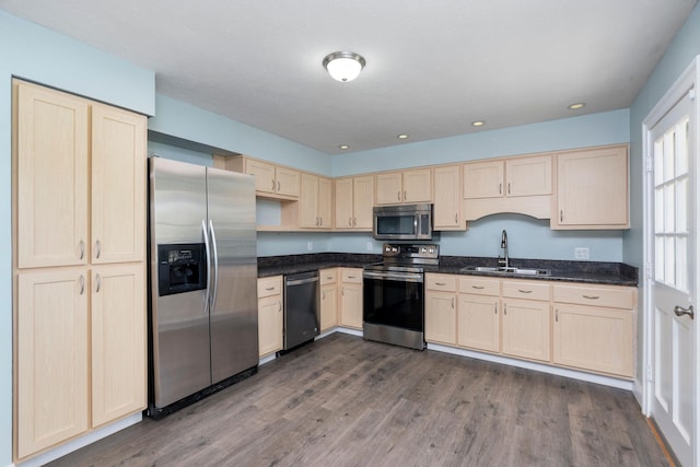 402 Marshall St, Staunton, VA 24401 - kitchen with stainless steel appliances, a sink, light brown cabinets, dark wood finished floors, and recessed lighting