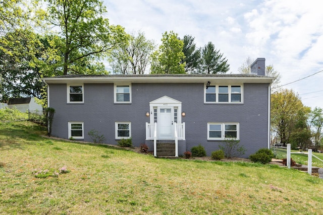 402 Marshall St, Staunton, VA 24401 - bi-level home with a chimney, a front lawn, and brick siding