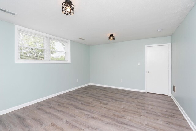 402 Marshall St, Staunton, VA 24401 - empty room with wood finished floors and baseboards