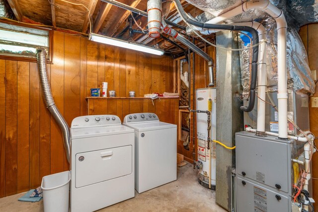 402 Marshall St, Staunton, VA 24401 - laundry area with washer and clothes dryer, gas water heater, and wooden walls