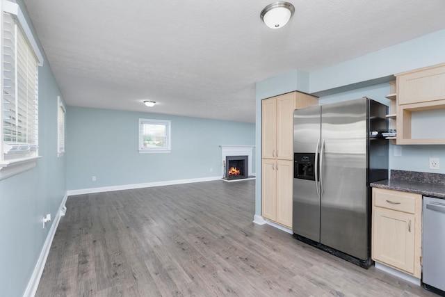 402 Marshall St, Staunton, VA 24401 - kitchen featuring appliances with stainless steel finishes, open shelves, dark countertops, light brown cabinets, and open floor plan