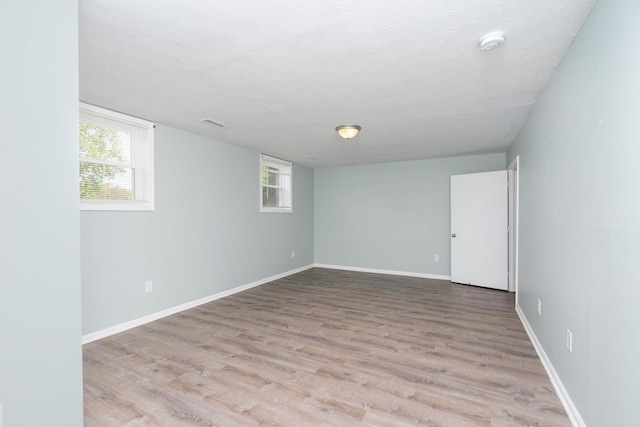 402 Marshall St, Staunton, VA 24401 - basement with wood finished floors, a textured ceiling, and baseboards