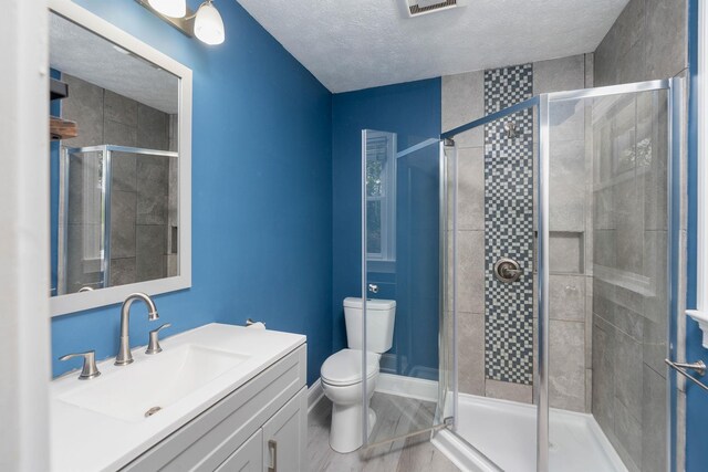 402 Marshall St, Staunton, VA 24401 - full bath with a stall shower, a textured ceiling, toilet, and vanity