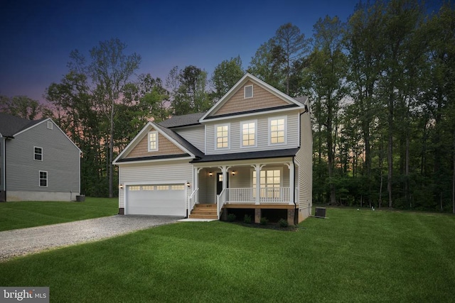 405 Richmond Ave, Mineral, VA 23117 - traditional home with a porch, gravel driveway, a lawn, and an attached garage