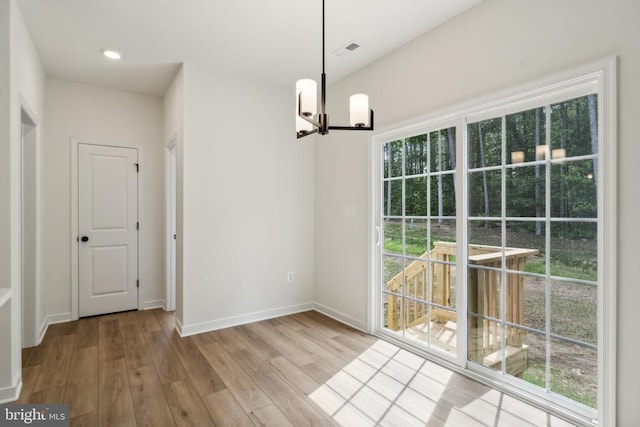 405 Richmond Ave, Mineral, VA 23117 - unfurnished dining area with a chandelier and wood finished floors