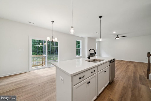 405 Richmond Ave, Mineral, VA 23117 - kitchen with stainless steel dishwasher, light wood finished floors, ceiling fan, light countertops, and a chandelier