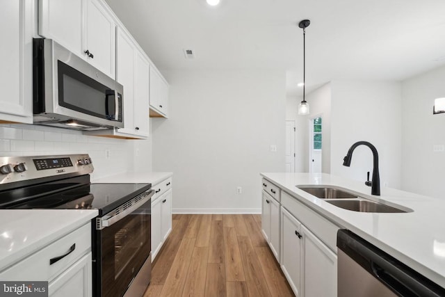 405 Richmond Ave, Mineral, VA 23117 - kitchen with stainless steel appliances, tasteful backsplash, light wood finished floors, light countertops, and recessed lighting