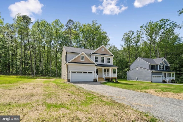 405 Richmond Ave, Mineral, VA 23117 - view of front of home with covered porch, driveway, a front yard, and an attached garage