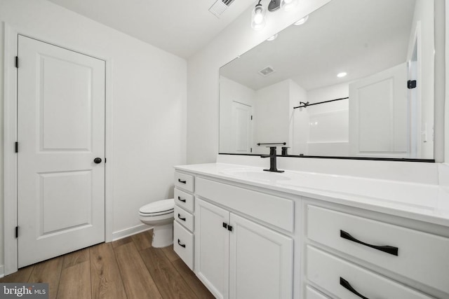 405 Richmond Ave, Mineral, VA 23117 - bathroom featuring vanity, wood finished floors, and recessed lighting