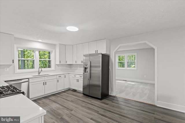 3050 Patriot Ln, Fredericksburg, VA 22408 - kitchen with stainless steel refrigerator with ice dispenser, light countertops, white cabinets, a textured ceiling, and dark wood-style floors