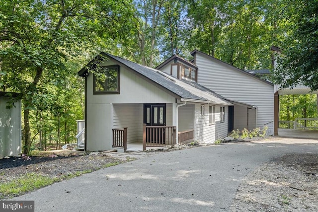 3050 Patriot Ln, Fredericksburg, VA 22408 - view of front of property with driveway, roof with shingles, covered porch, and a carport