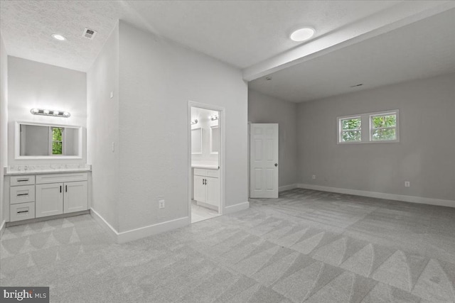 3050 Patriot Ln, Fredericksburg, VA 22408 - unfurnished bedroom featuring ensuite bathroom, light carpet, and a textured ceiling