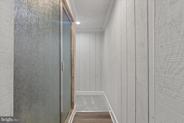 3050 Patriot Ln, Fredericksburg, VA 22408 - hall featuring crown molding, wood finished floors, wooden walls, and recessed lighting