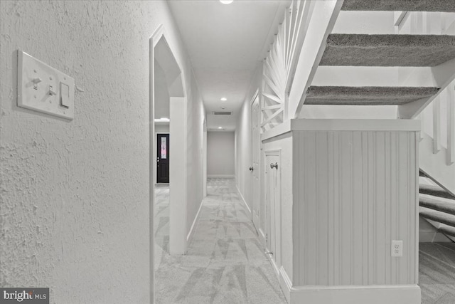 3050 Patriot Ln, Fredericksburg, VA 22408 - corridor featuring stairs, a textured wall, and carpet floors