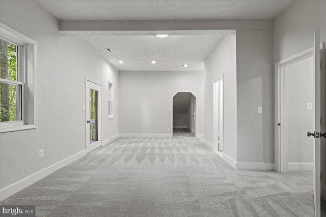 3050 Patriot Ln, Fredericksburg, VA 22408 - corridor with carpet, arched walkways, recessed lighting, and a textured ceiling