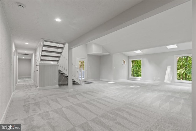 3050 Patriot Ln, Fredericksburg, VA 22408 - unfurnished living room featuring stairs, light colored carpet, vaulted ceiling, and recessed lighting