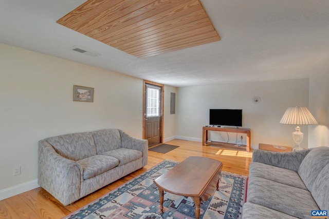 3340 James River Rd, Howardsville, VA 24562 - living area with light wood-style floors, visible vents, baseboards, and wood ceiling