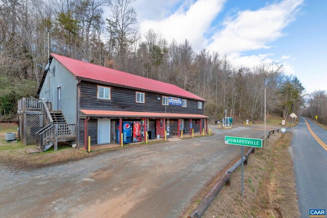 3340 James River Rd, Howardsville, VA 24562 - view of front of home featuring metal roof, stairs, and a wooden deck
