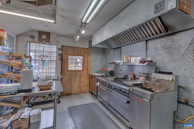 3340 James River Rd, Howardsville, VA 24562 - kitchen featuring vaulted ceiling, extractor fan, and concrete flooring