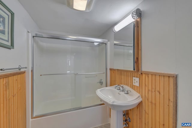 3340 James River Rd, Howardsville, VA 24562 - full bathroom featuring enclosed tub / shower combo, wooden walls, and a sink