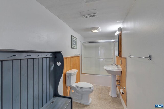 3340 James River Rd, Howardsville, VA 24562 - bathroom featuring toilet, enclosed tub / shower combo, a sink, tile patterned floors, and visible vents