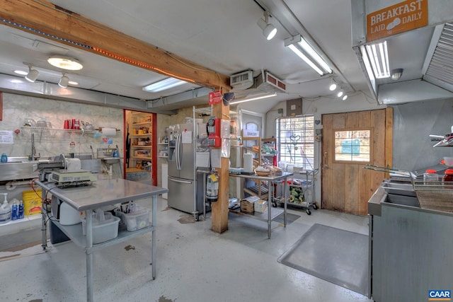3340 James River Rd, Howardsville, VA 24562 - below grade area with a workshop area and stainless steel fridge