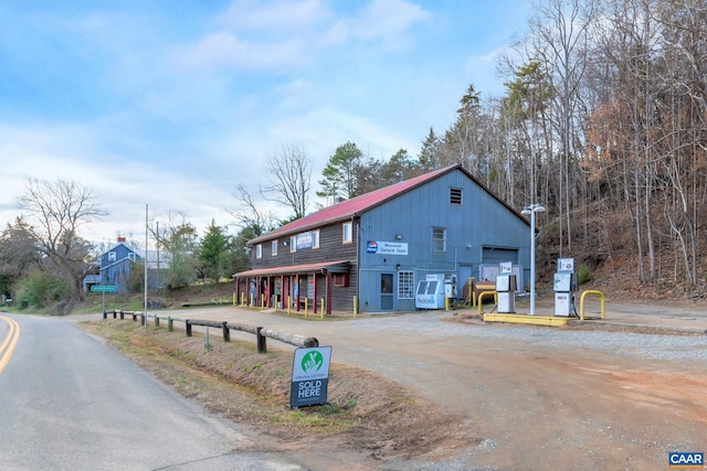3340 James River Rd, Howardsville, VA 24562 - exterior space featuring metal roof, driveway, and a detached garage
