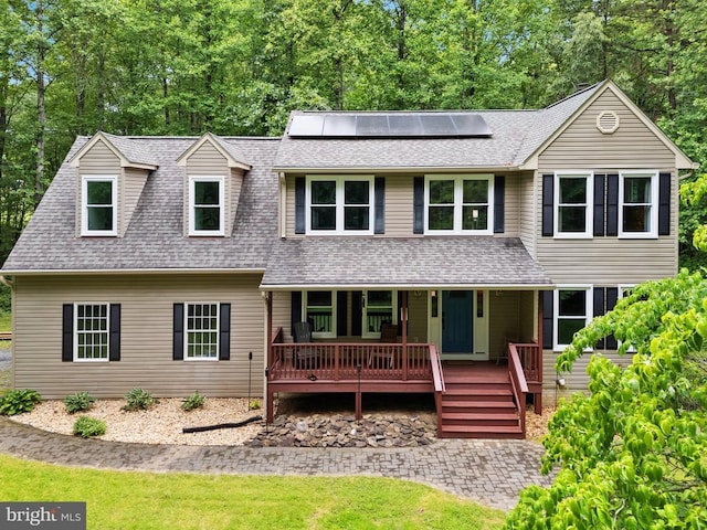11332 Brinker Ct, Culpeper, VA 22701 - view of front of property featuring roof mounted solar panels, roof with shingles, covered porch, and view of wooded area