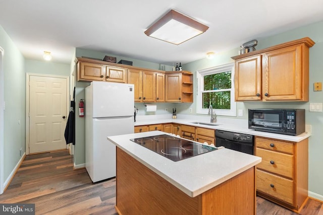 11332 Brinker Ct, Culpeper, VA 22701 - kitchen with black appliances, a sink, dark wood-style floors, and light countertops