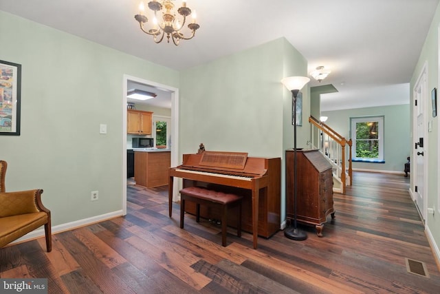 11332 Brinker Ct, Culpeper, VA 22701 - living area with stairs, dark wood finished floors, a chandelier, and baseboards