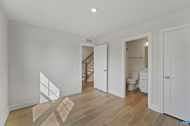 unfurnished bedroom with visible vents, light wood-style flooring, baseboards, and recessed lighting