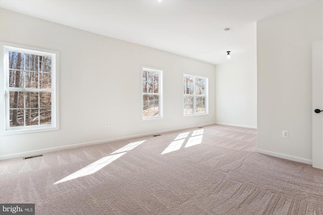  - unfurnished room with carpet floors and baseboards
