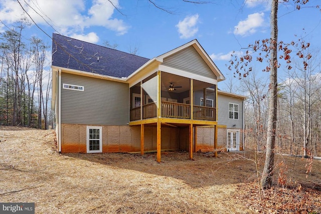  - rear view of house with ceiling fan, roof with shingles, french doors, a deck, and a sunroom