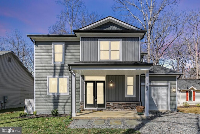 105 Chesterfield Ct, Locust Grove, VA 22508 - back of property with board and batten siding, a porch, a garage, and asphalt driveway