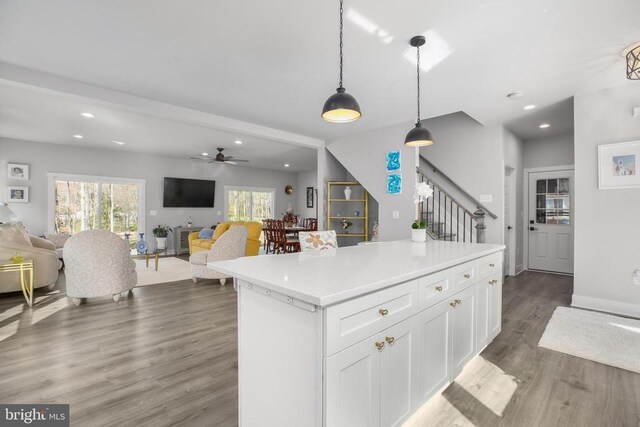 105 Chesterfield Ct, Locust Grove, VA 22508 - kitchen with open floor plan, wood finished floors, white cabinetry, decorative light fixtures, and recessed lighting