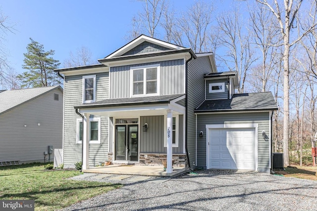 105 Chesterfield Ct, Locust Grove, VA 22508 - view of front of home featuring board and batten siding, a porch, a garage, cooling unit, and stone siding