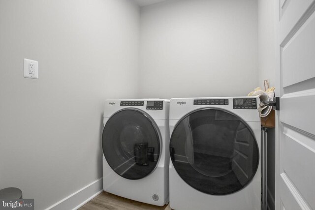 105 Chesterfield Ct, Locust Grove, VA 22508 - washroom featuring washing machine and dryer, baseboards, and wood finished floors