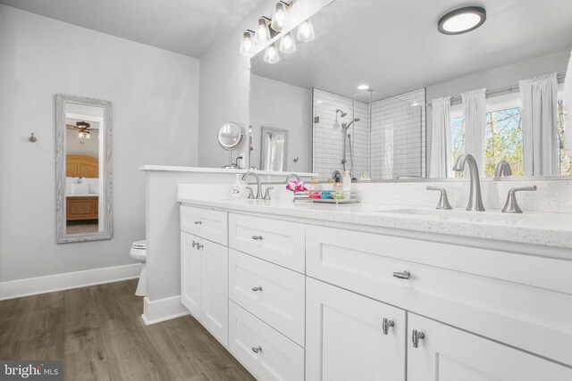 105 Chesterfield Ct, Locust Grove, VA 22508 - full bathroom with a stall shower, wood finished floors, baseboards, toilet, and double vanity
