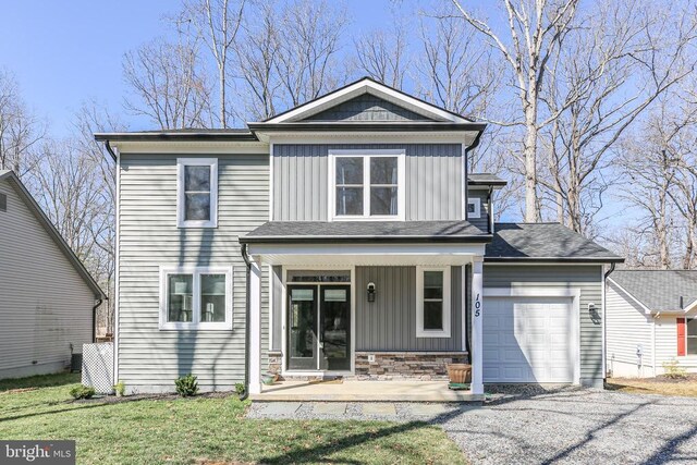 105 Chesterfield Ct, Locust Grove, VA 22508 - view of front of property featuring board and batten siding, a porch, an attached garage, and a front lawn