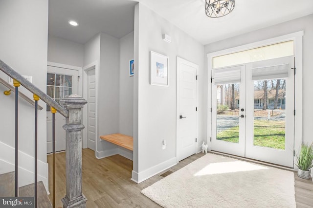 105 Chesterfield Ct, Locust Grove, VA 22508 - entrance foyer with french doors, wood finished floors, stairway, and baseboards