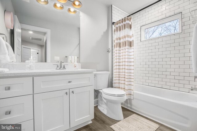 105 Chesterfield Ct, Locust Grove, VA 22508 - bathroom with wood finished floors, toilet, vanity, and shower / bathtub combination with curtain