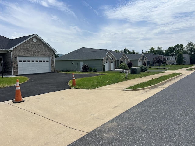 81 Meriwether Cir, Stuarts Draft, VA 24477 - single story home featuring brick siding, asphalt driveway, an attached garage, and a front yard