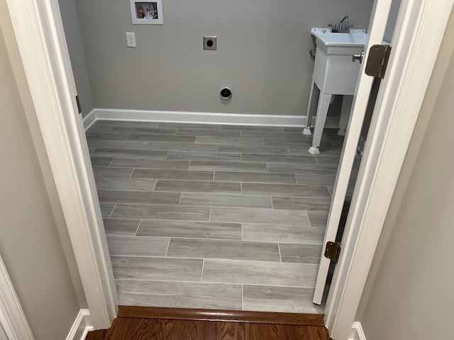 81 Meriwether Cir, Stuarts Draft, VA 24477 - laundry area featuring wood tiled floors, baseboards, and hookup for an electric dryer
