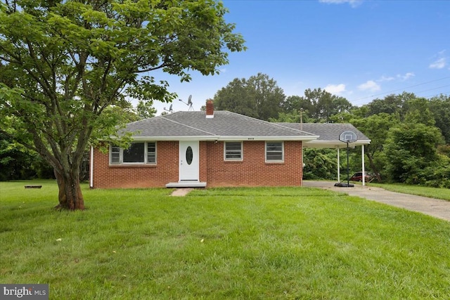 4970 Ridge Rd, Spotsylvania, VA 22551 - view of front facade featuring driveway, a front lawn, a chimney, an attached carport, and brick siding