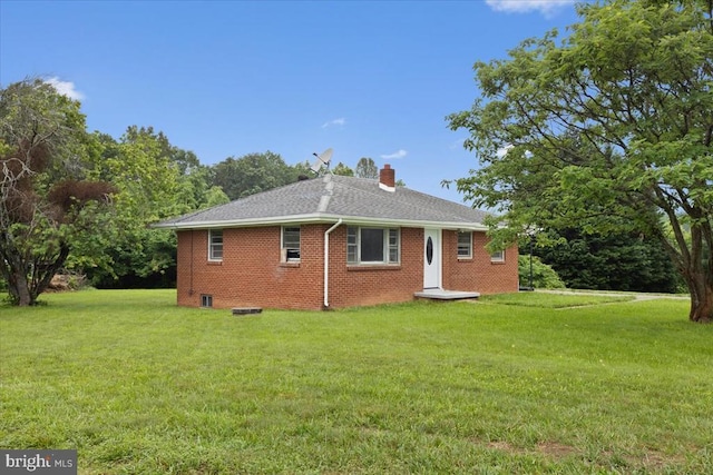 4970 Ridge Rd, Spotsylvania, VA 22551 - back of property featuring a lawn, a chimney, brick siding, and a shingled roof